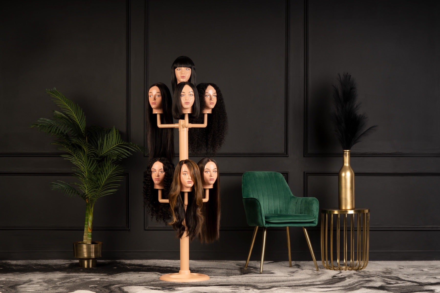 The wig hanger with 7 worn mannequin heads in a dark and cosy living room.